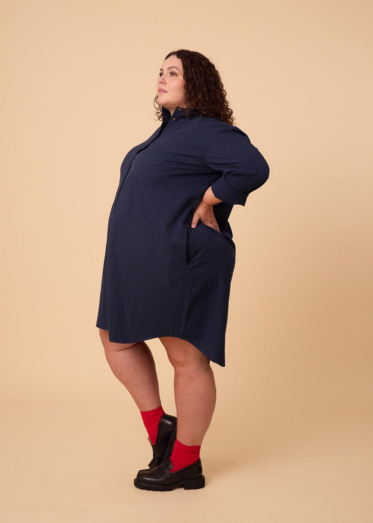 plus size person in a navy shirt dress