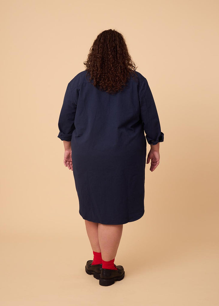 plus size person in a navy shirt dress