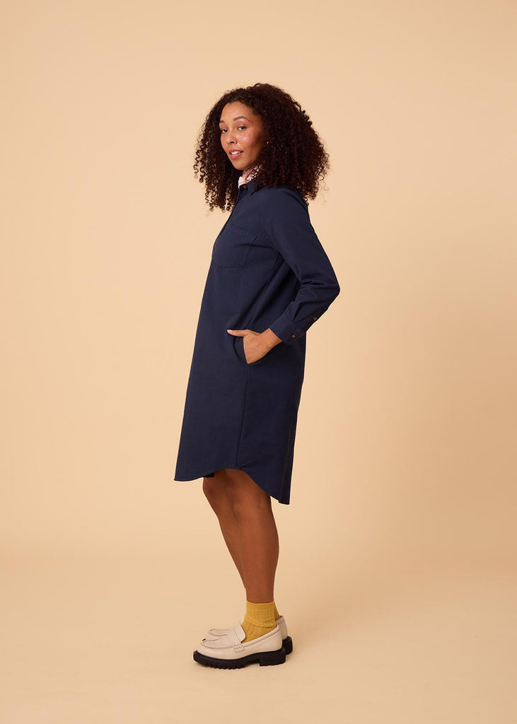 straight size woman in a navy shirt dress