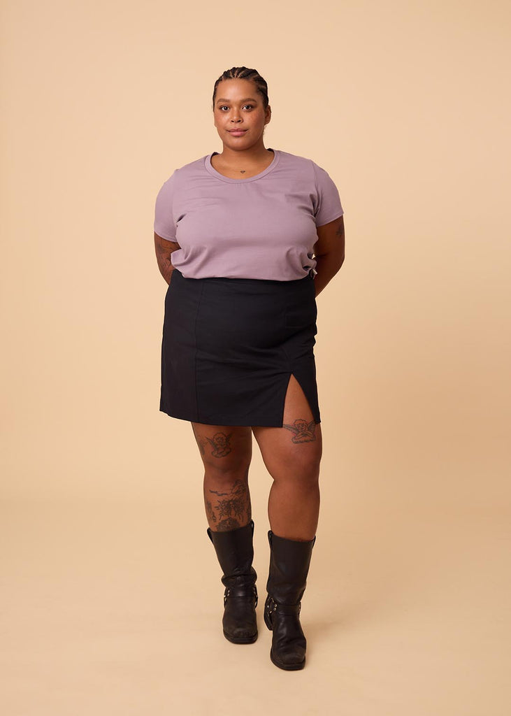 plus size woman in lavender tee shirt