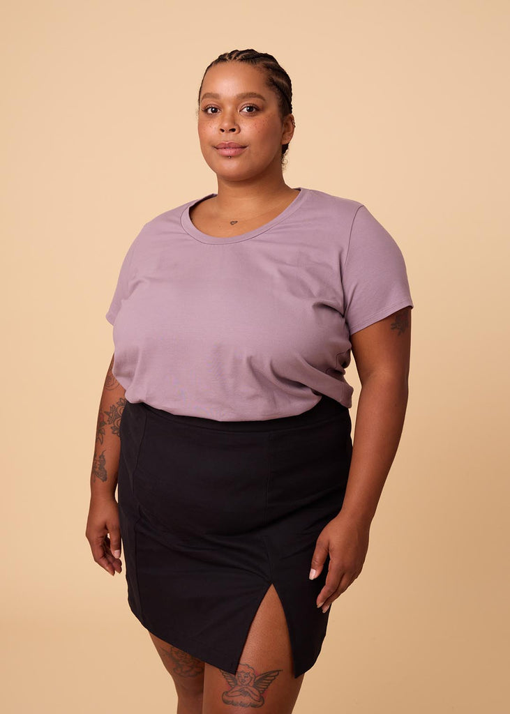 plus size woman in lavender tee shirt