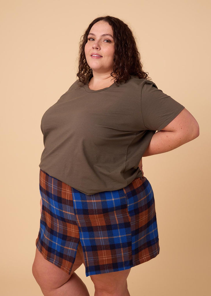 plus size woman in olive green tee shirt