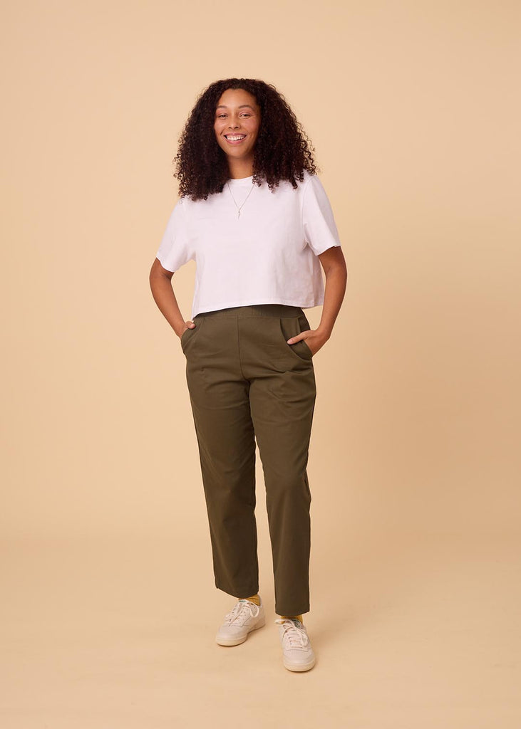 straight size woman wearing olive green straight leg pants