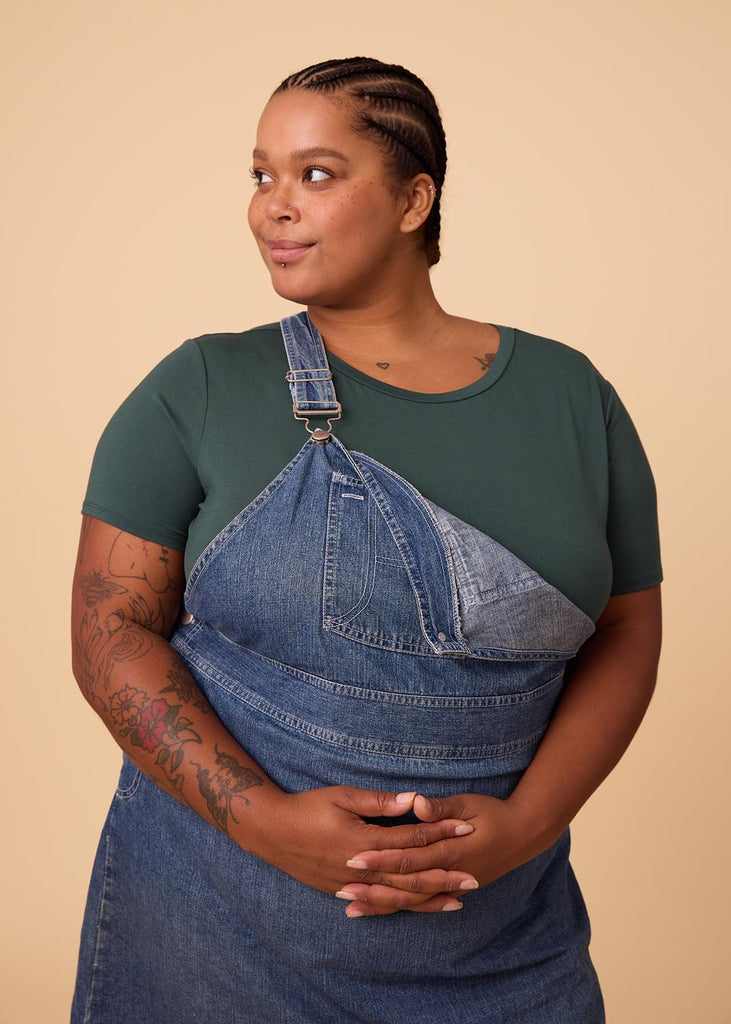 plus size woman in a deep green tee shirt