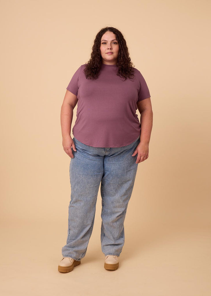 plus size woman in a violet tee shirt