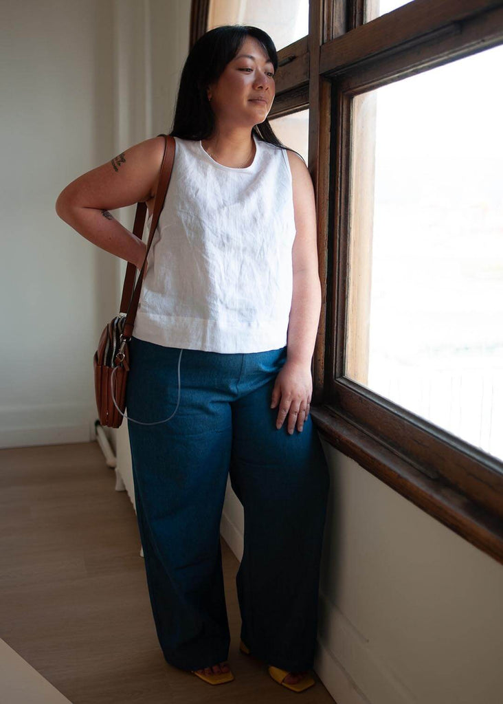 mid size woman wearing wide leg denim pants