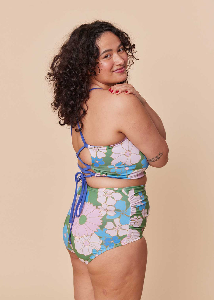 a straight size woman wearing a floral bikini