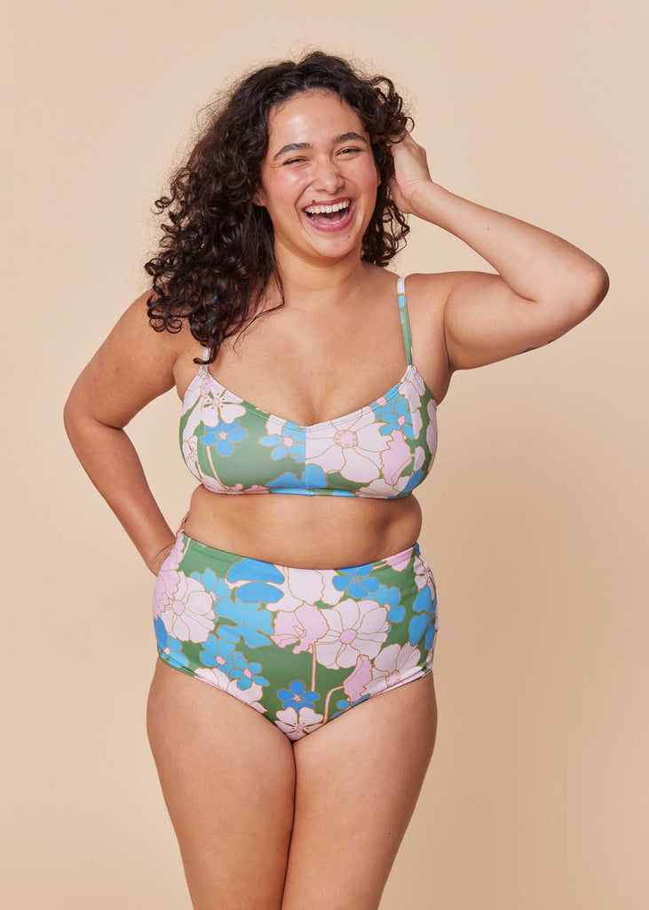 a mid size woman in a floral two piece bathing suit