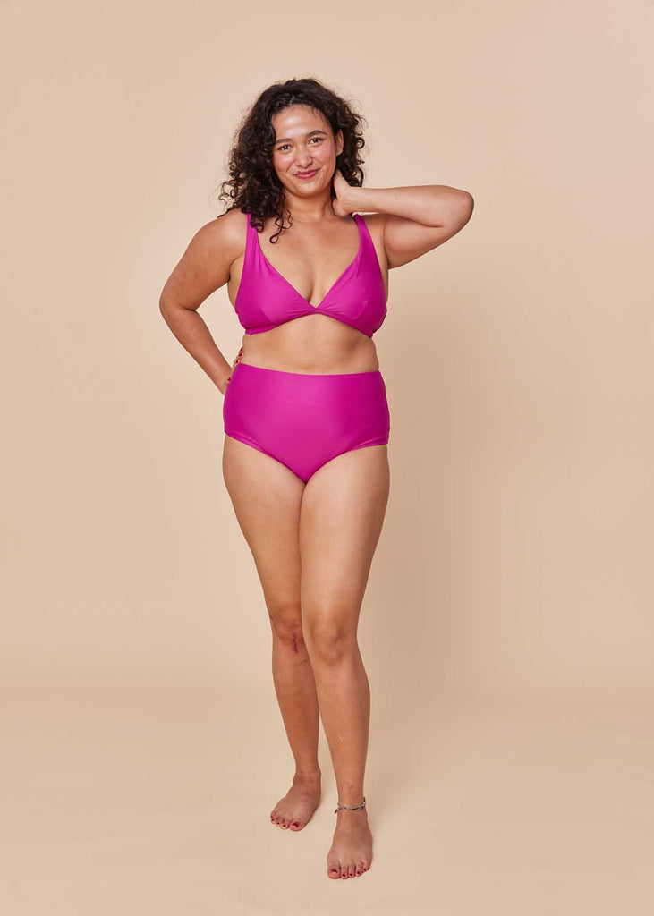 a straight size woman wearing a pink bikini