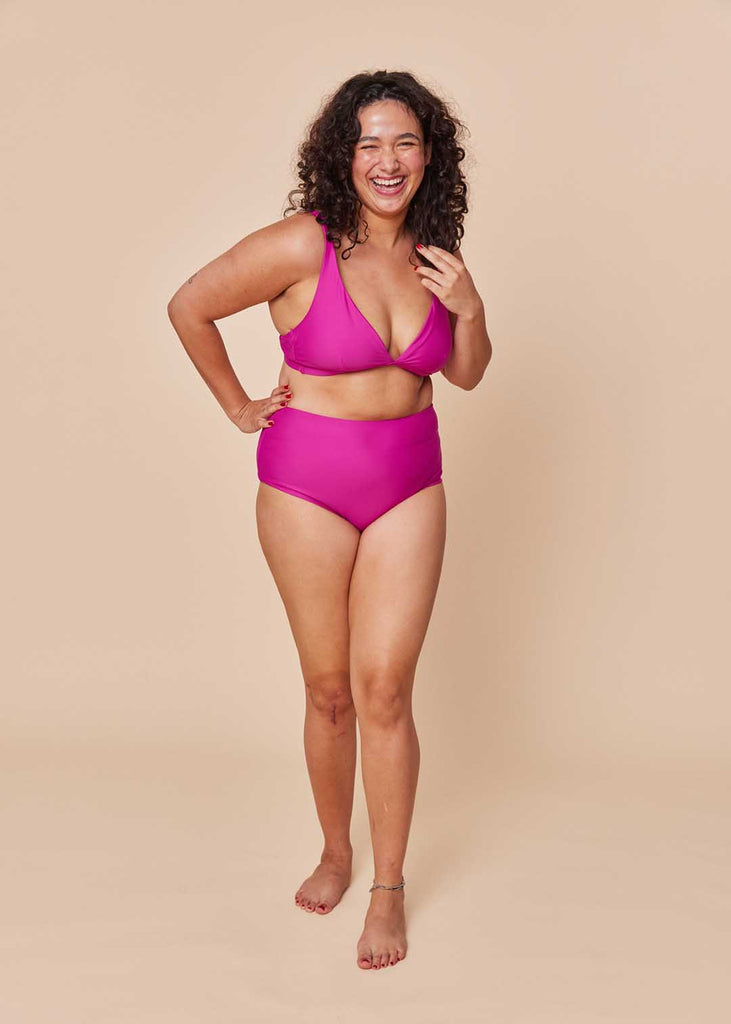 a midsize woman wearing a pink bikini