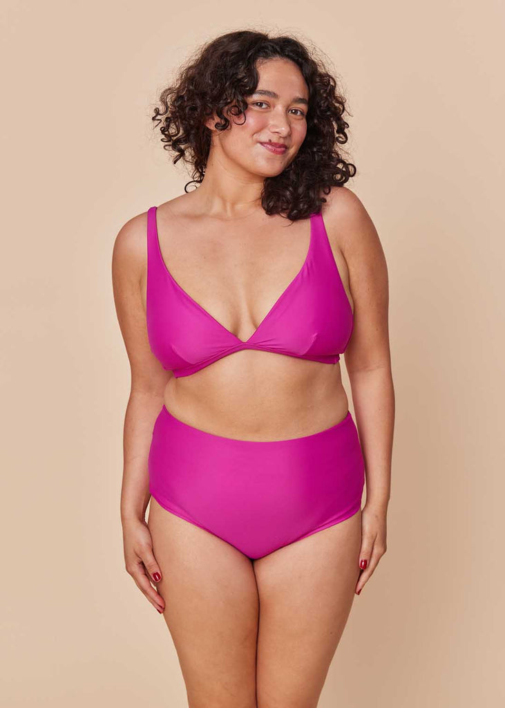 a midsize woman wearing a pink bikini