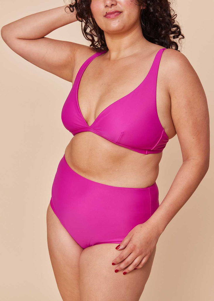 a midsize woman wearing a pink bikini