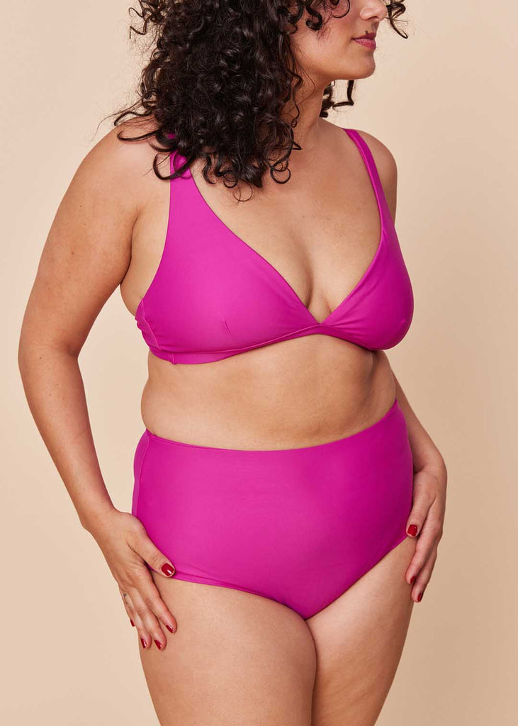 a straight size woman wearing a pink bikini