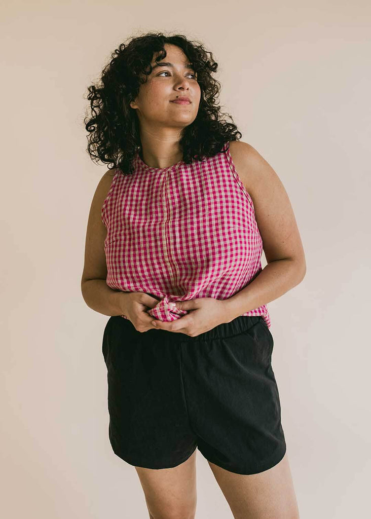 a midsize woman wearing black shorts