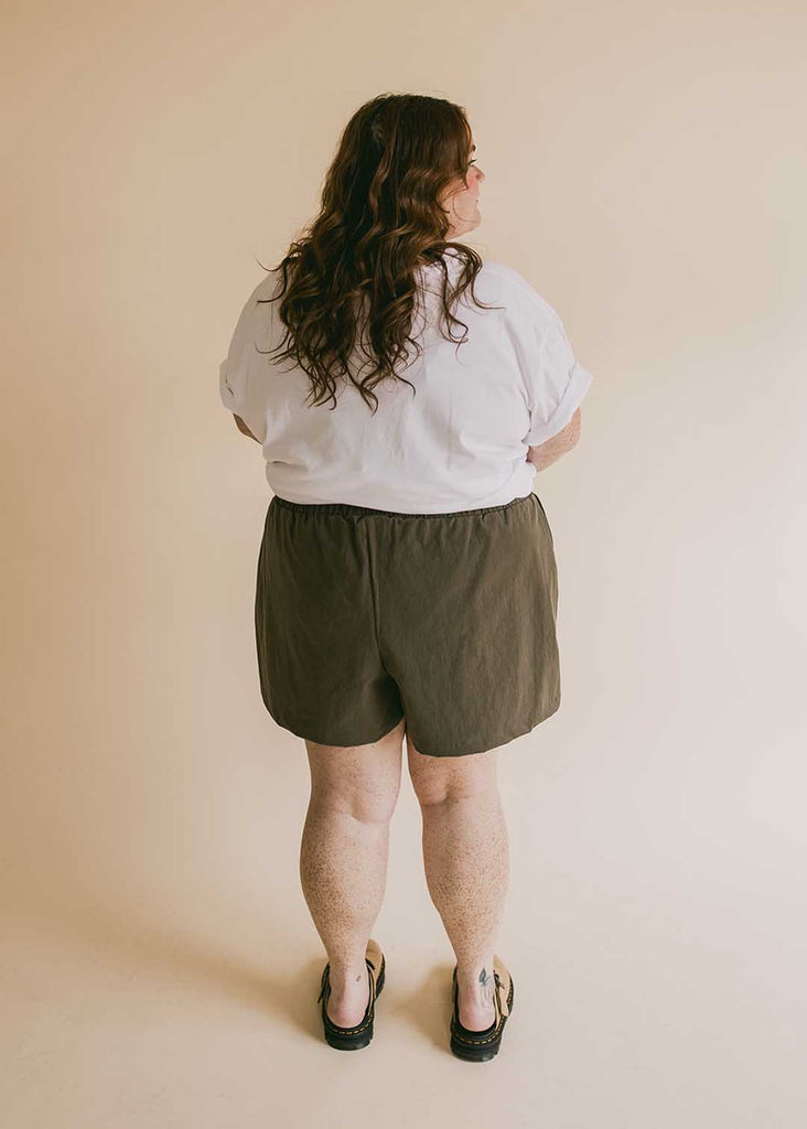 plus size woman in oversized white tee