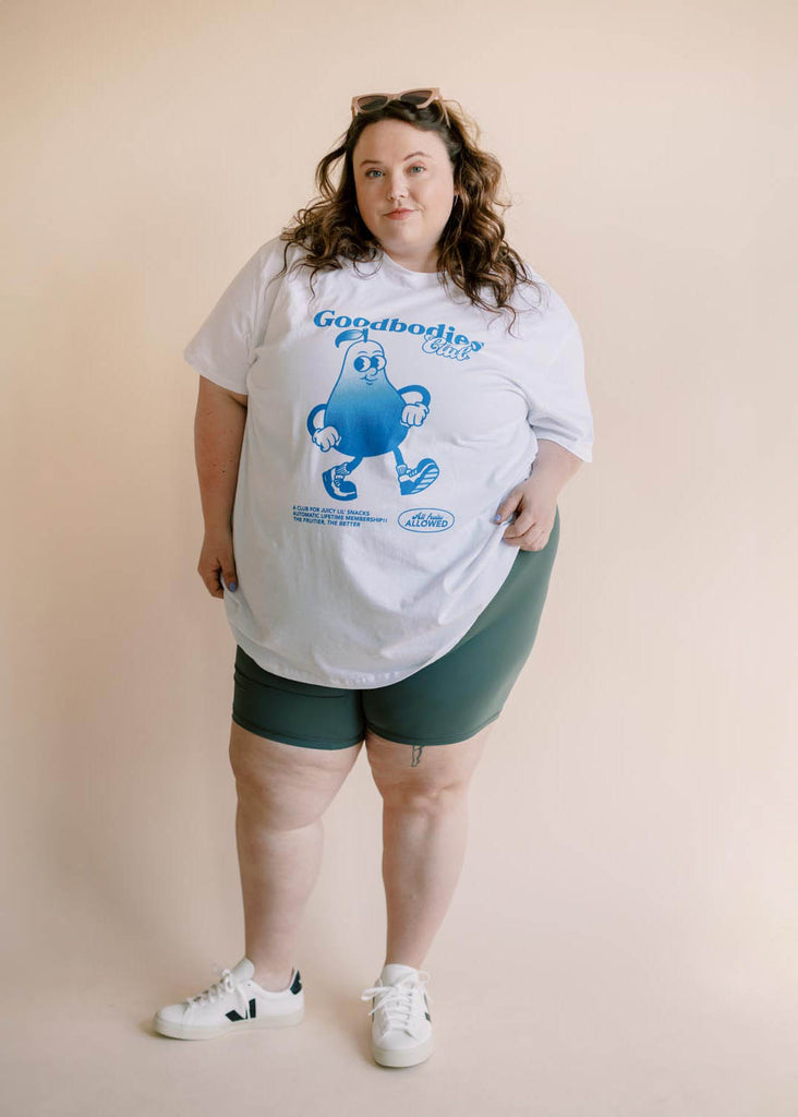 a plus size woman wearing a graphic tee