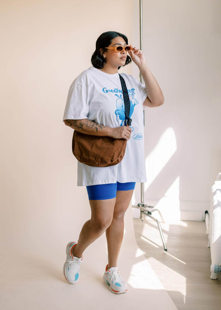 a plus size woman wearing a graphic tee