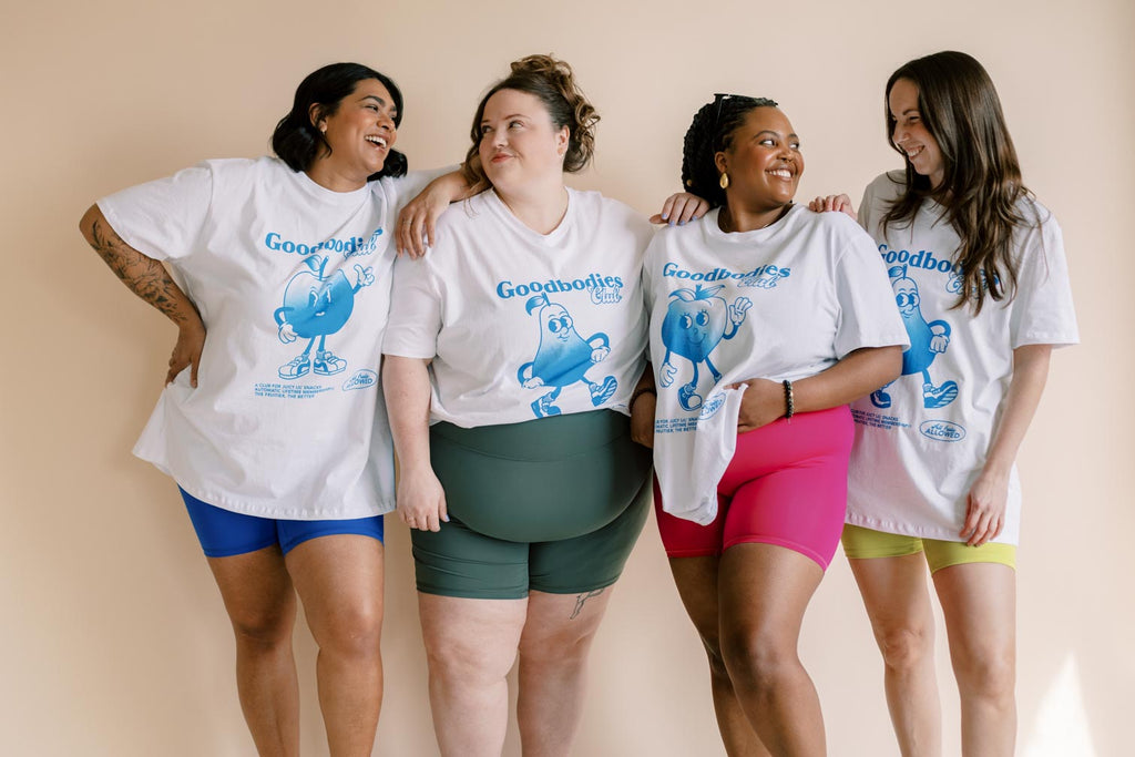 a group of women wearing graphic tees