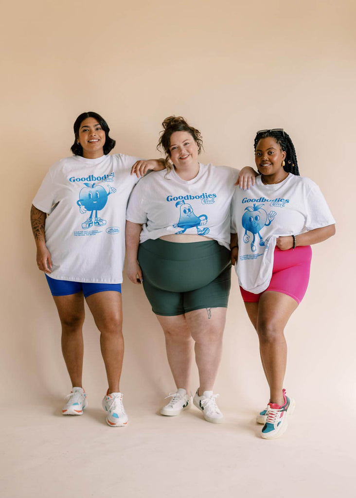 a group of three plus size women wearing bike shorts in different colours