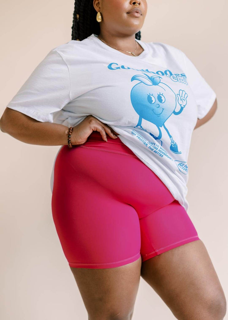 a close up of a woman wearing pink bike shorts