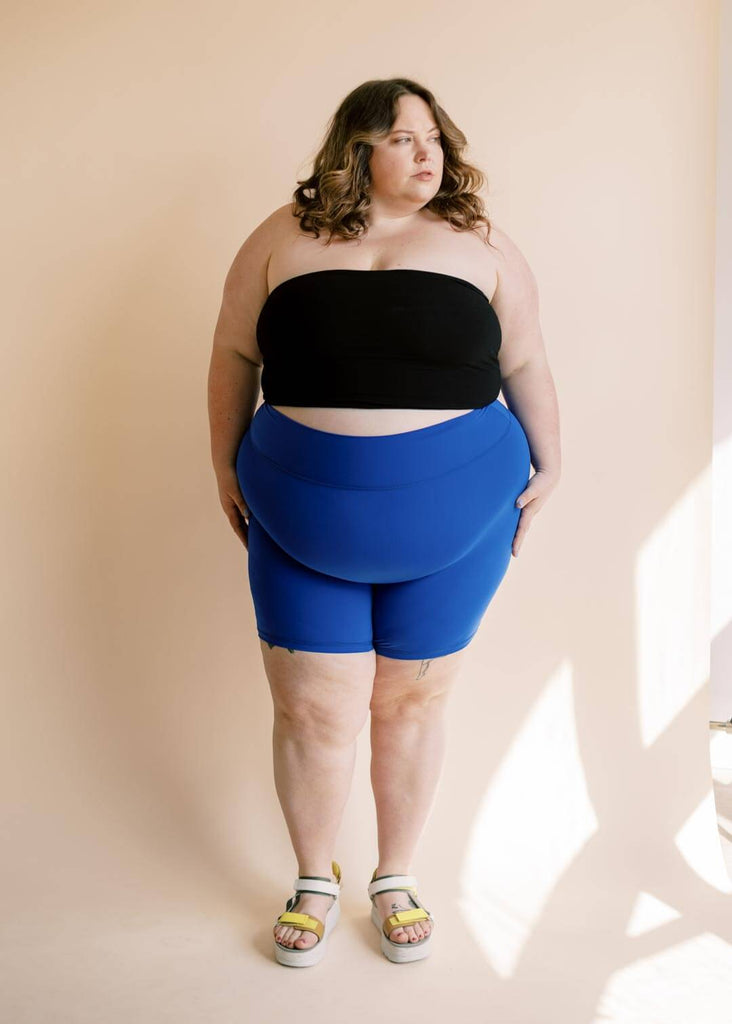 plus size woman wearing blue bike shorts