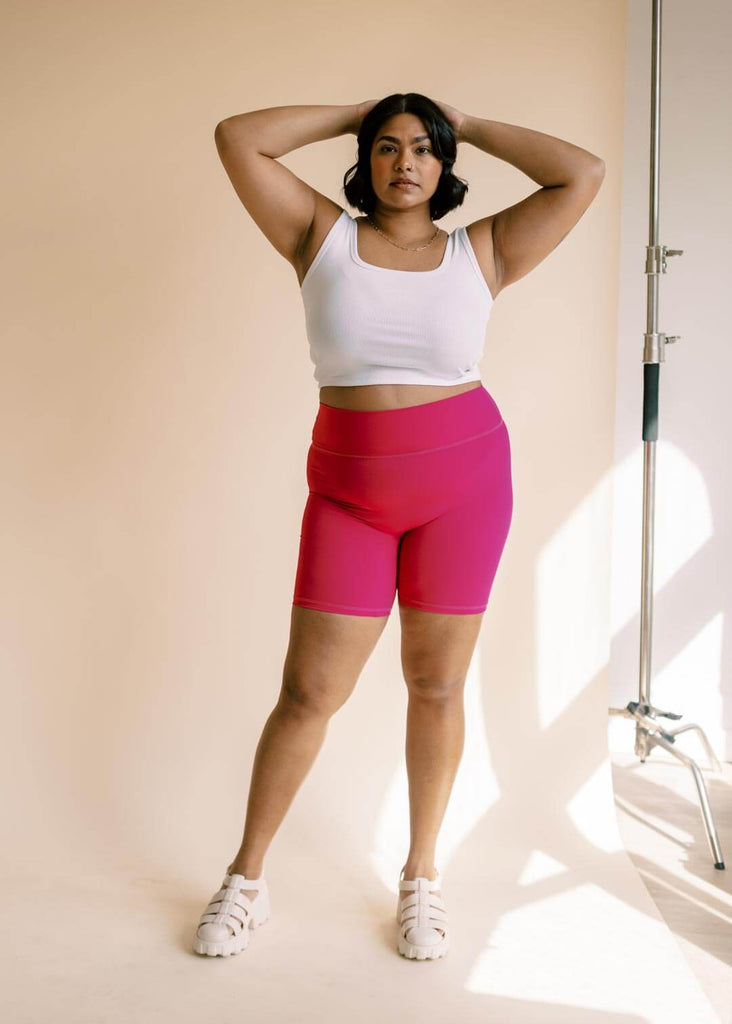 a woman wearing pink bike shorts