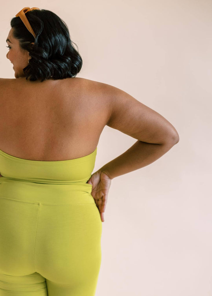 a plus size woman wearing a green bandeau