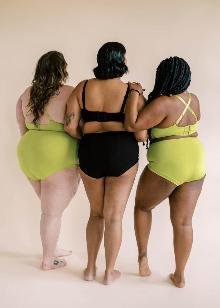 a trio of women wearing matching underwear sets