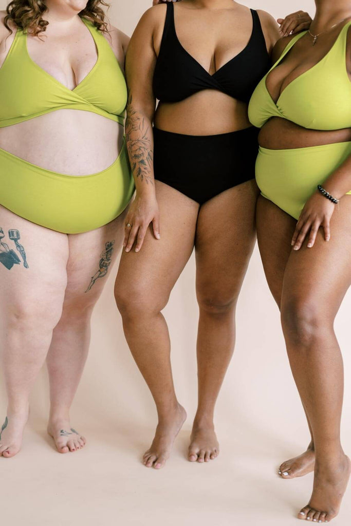 a trio of plus sized women wearing matching underwear sets