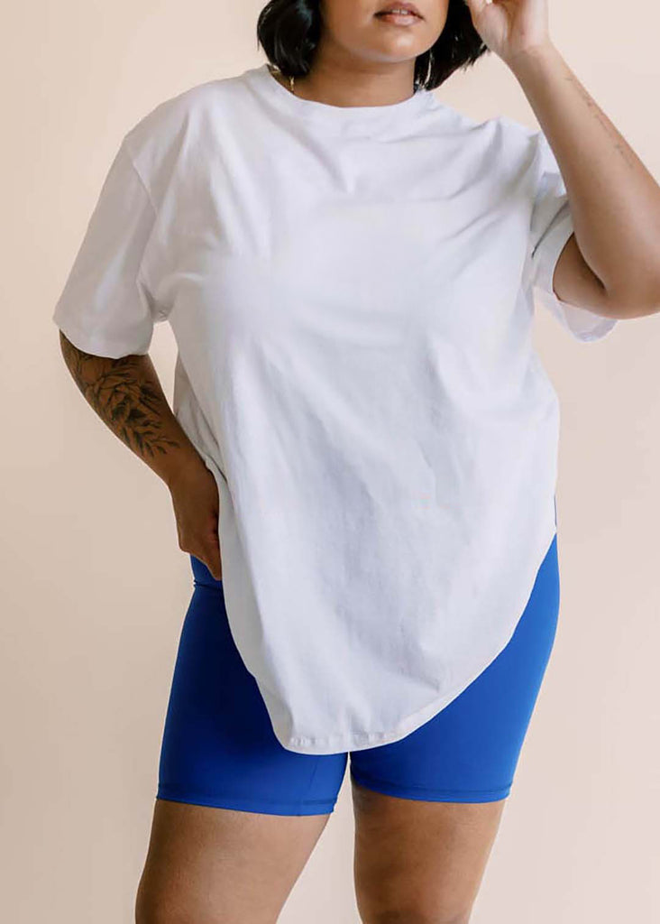 plus size woman in oversized white tee