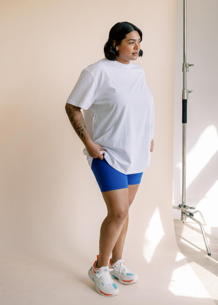 plus size woman in oversized white tee