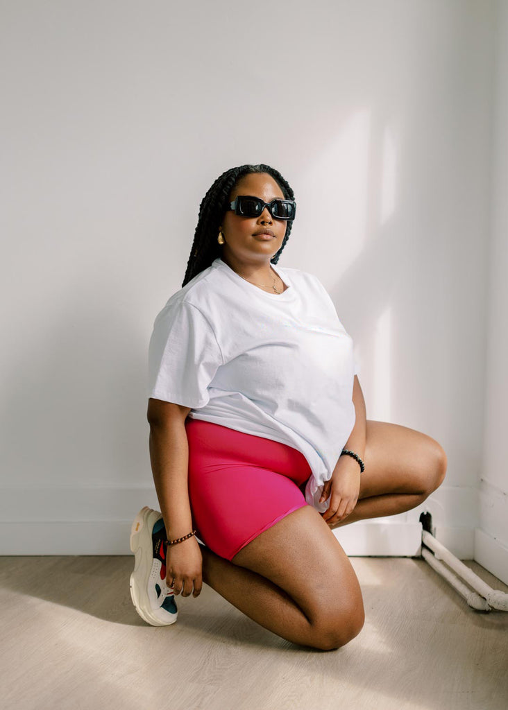 plus size woman in oversized white tee