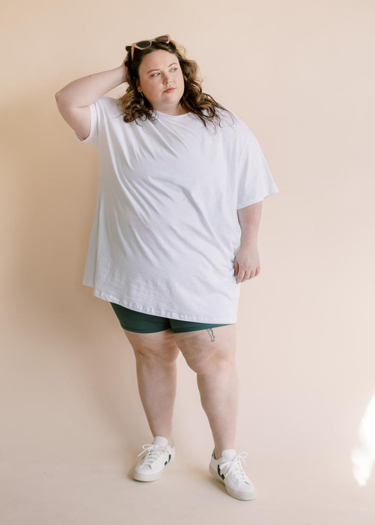 plus size woman in oversized white tee