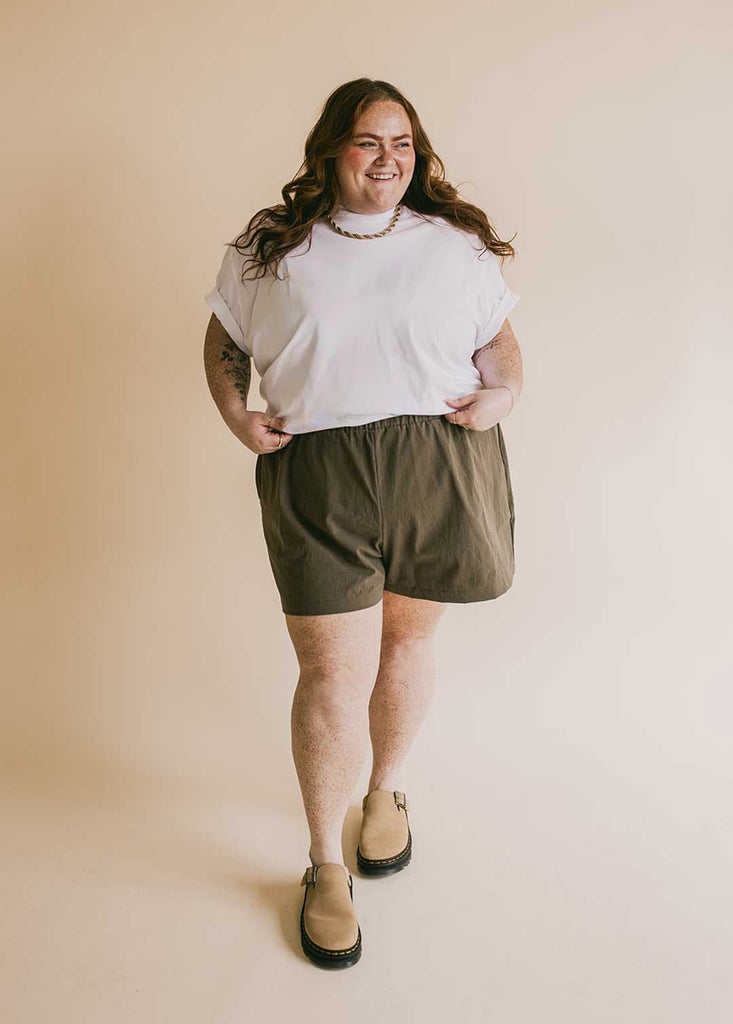 plus size woman in oversized white tee