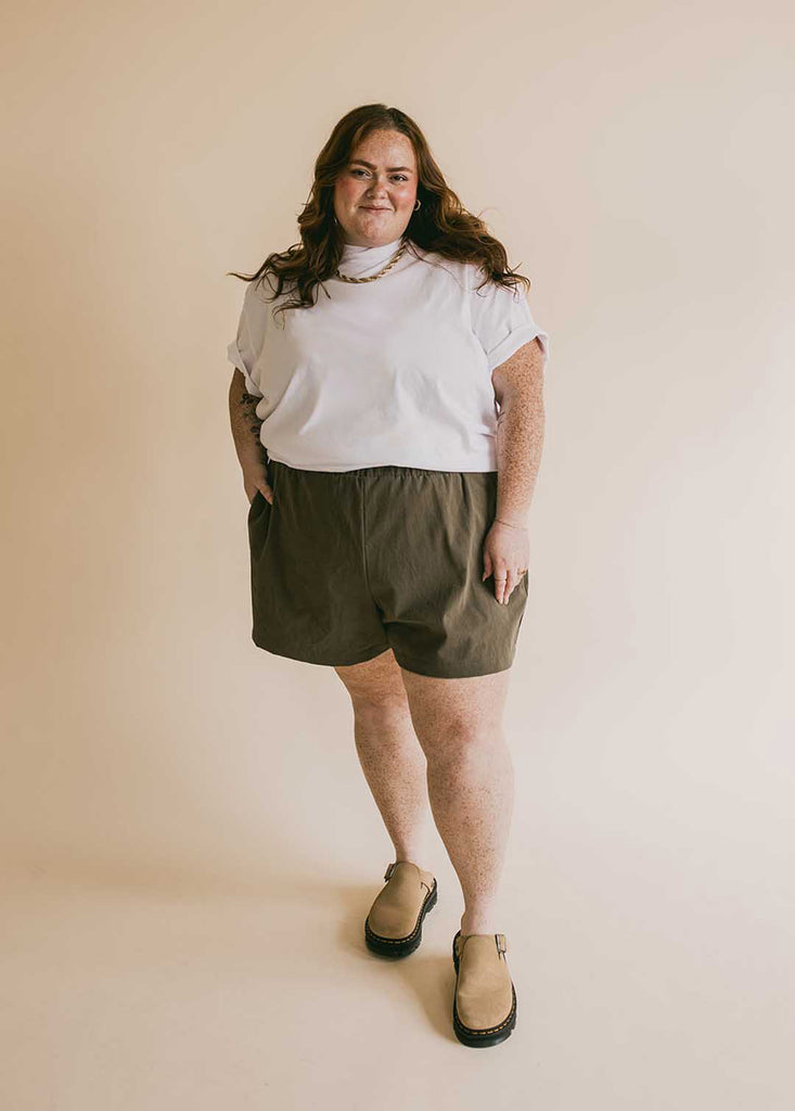 plus size woman in oversized white tee