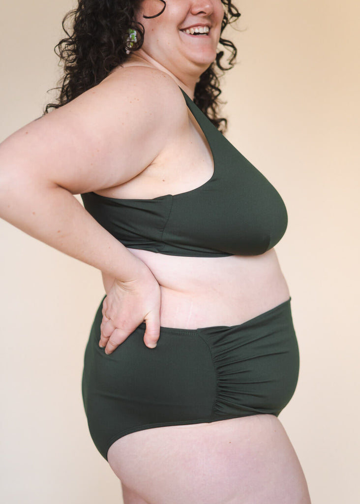 a plus size woman in a green bikini