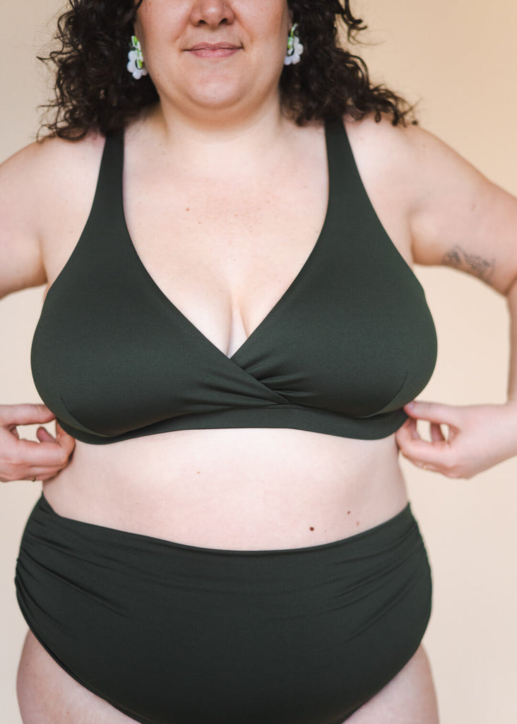 a plus size woman in a green bikini