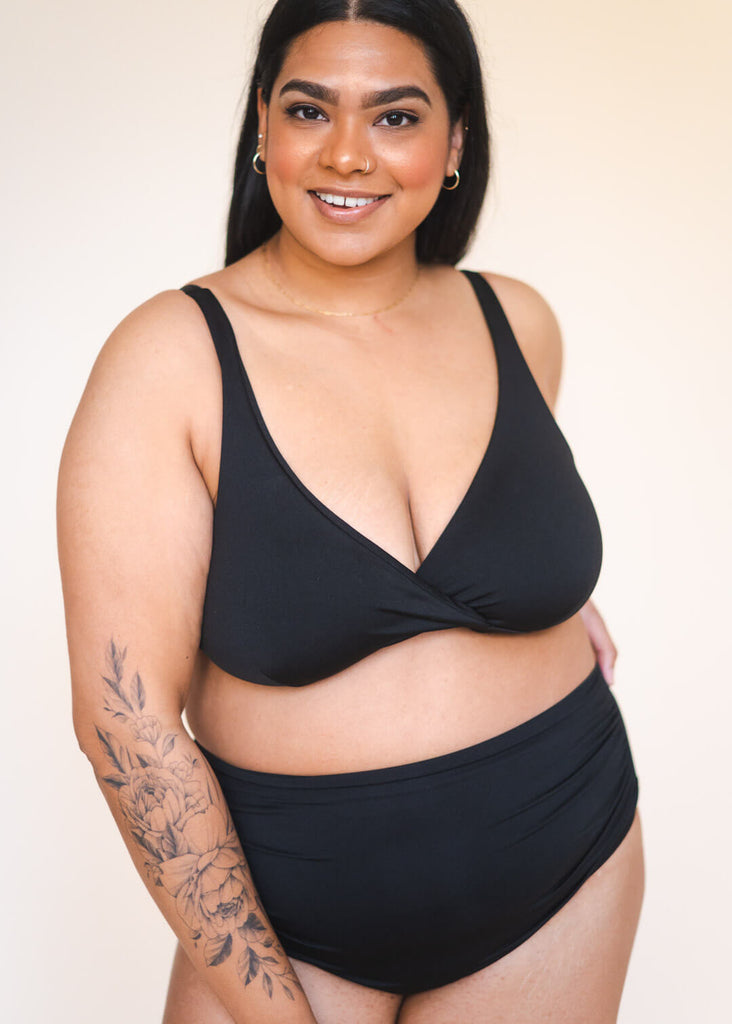 a mid size woman in a black bikini