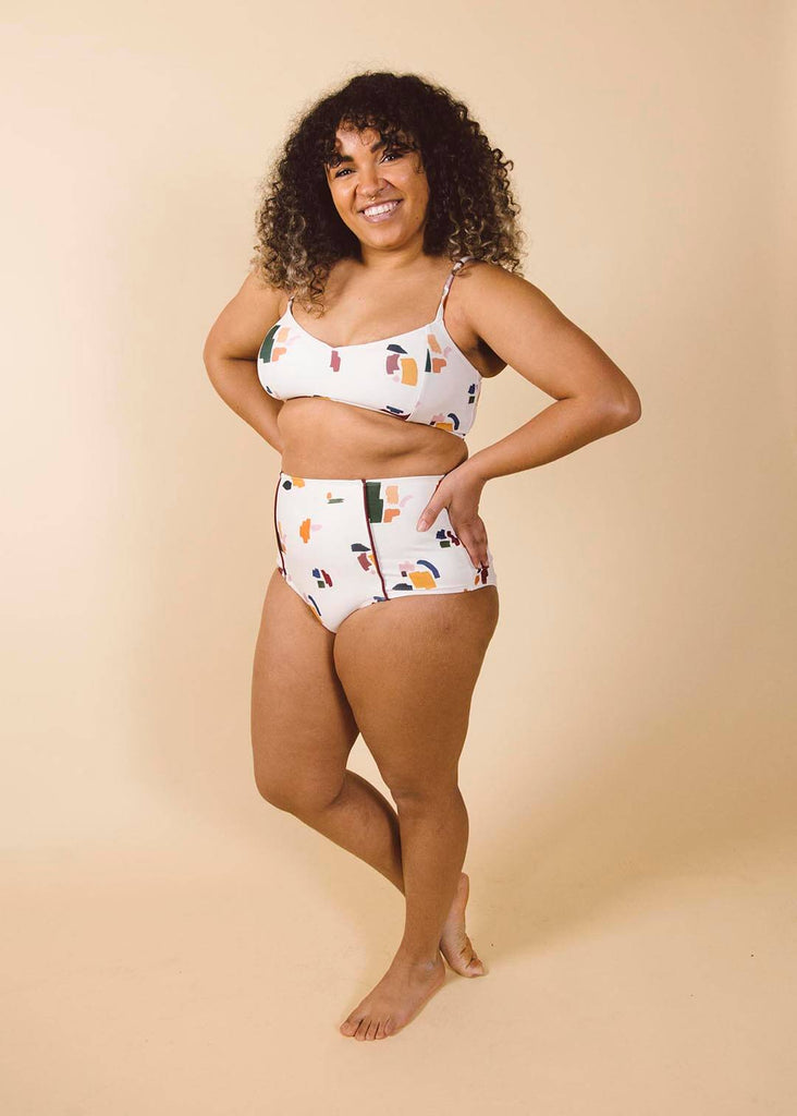 a mid size woman wearing a printed bikini