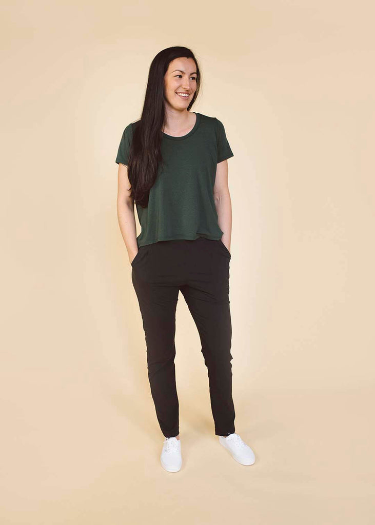 a straight size woman wearing black tapered pants